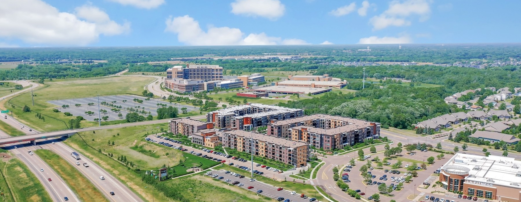 aerial view of buildings parking lots and highways