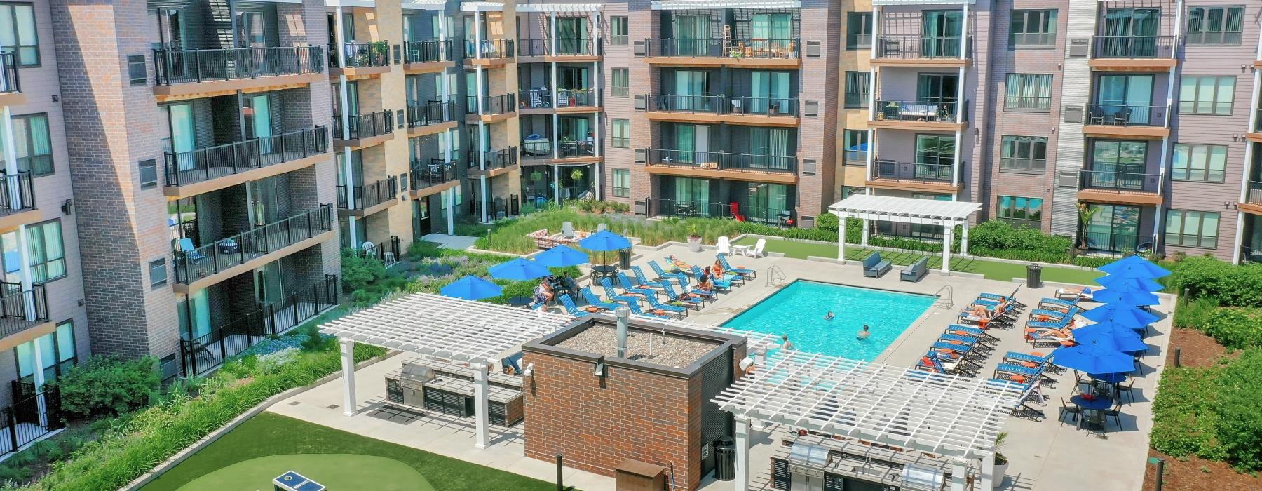 a building with a lawn and a swimming pool