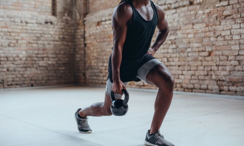 Find your perfect fit at 610 West a man doing lunges with kettlebell