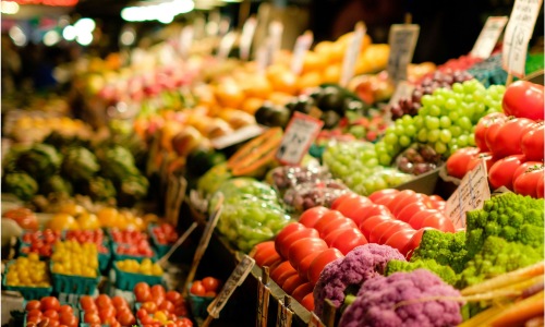 Vibrant community life with a variety of shopping options a market with vegetables and fruits