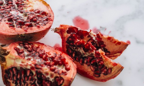 Close to the center of everything a pomegranate cut