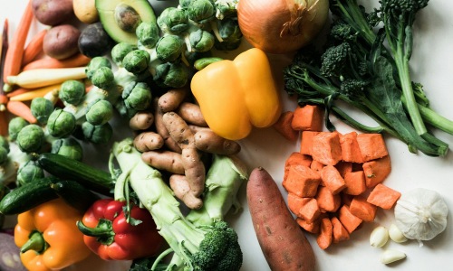 a table full of vegetables Close to the center of everything