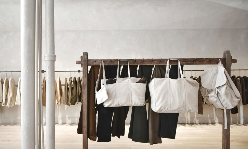 Vibrant community life with a variety of shopping options a row of clothes and bags on a rack