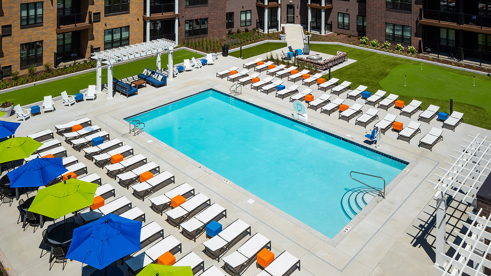 Aerial pool deck shot with outdoor lounge furniture